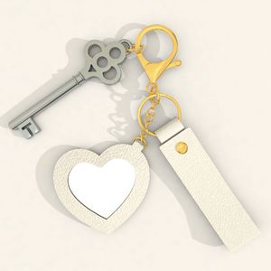 Low MOQ Cute and Creative Small PU <b>Leather</b> Heart-shaped Mirror <b>Keychain</b> with Many Colors for Bag Pendant in Stock - Product Image 4