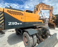 Excavatrice sur pneus Hyundai R210W d'occasion d'origine coréenne, 9 roues, bien entretenue, 21 tonnes, hydraulique