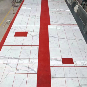 กระเบื้องหินอ่อนขัดเงาคุณภาพสูง Calacatta White OEM/ODM สำหรับขายส่ง ทนทาน กันน้ำ เหมาะสำหรับตกแต่งภายในห้องนั่งเล่น โรงแรม - Product Image 5