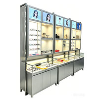Présentoir à lunettes moderne en verre argenté et métal à plusieurs niveaux avec éclairage LED pour armoire autoportante