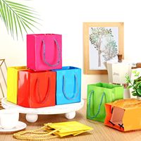 Bolsas de Compra de Papel Brillante Blanco, Negro y Naranja con Estampado en Caliente Personalizado Premium para Empaquetado de Joyería, Cosméticos y Artículos de Lujo