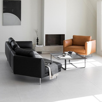 Canapé d'angle minimaliste italien en forme de L pour salon, grand ensemble modulaire pour hôtel à plancher plat, canapé en cuir noir
