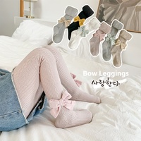Vente en gros de leggings ras du cou pour enfants combinaison avec nœud de couleur unie et motif papillon printemps automne chaussettes pour bébés pour filles