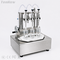 Machine de remplissage volumétrique à trois têtes pour parfums et liquides, petite machine de remplissage de liquides avec fixation réglable pour la production