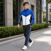 Ensemble de survêtement personnalisé pour homme avec fermeture éclair intégrale, blocs de couleur en V, col montant et pantalon droit pour l'entraînement sportif