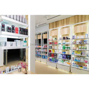 Étagères de <span class=keywords><strong>pharmacie</strong></span> blanches avec lumières, décoration de meubles de magasin de <span class=keywords><strong>pharmacie</strong></span> personnalisé, boîte d'éclairage supérieure, exposition murale de médecine à vendre - Product Image 2