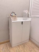 Meuble à chaussures de rangement simple de style nordique pour entrée, couloir et balcon, avec casier de rangement surélevé