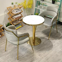 Ensemble table et chaises de luxe en acier inoxydable couleur marbre pour réception commerciale, négociation, restaurant, hôtel, café