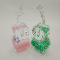 Support à stylos en acrylique style violoncelle exquis, avec liquide et paillettes flottantes, figurine adorable à l'intérieur, attrayant l'attention