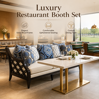 Ensemble de chaises et tables rembourrées pour restaurant avec plateau en pierre frittée et base à colonne unique en or brossé pour salle à manger d'hôtel