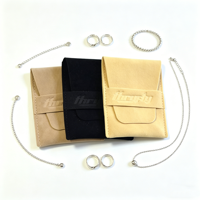 Pochette de luxe en suède avec rabat, petit format, logo gaufré, pour bijoux et bagues