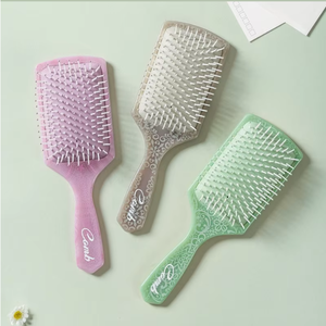 Brosse à cheveux démêlante ronde à manche en plastique, style creux, pour usage domestique, vente en gros à bas prix - Product Image 4