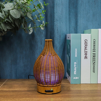 Diffuseur d'huiles essentielles en rotin plastique électrique OEM 100 ml, lumière nocturne, humidificateur à brume fraîche, tissage en bois, pour la maison