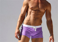 Vente en gros Nouveauté 2024 Maillot de bain homme sexy uni, short de surf et de plage avec cordon de serrage et poche, coupe ajustée