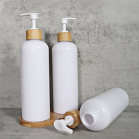 Bouteille vide de pompe de lotion de lavage de main de shampooing en plastique PET transparent blanc de 300ml 500ml avec pompe en bambou de PP
