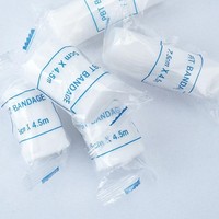 Haute qualité en gros de qualité médicale respirant PBT plissé pansement élastique soins des plaies gaze pansement rouleau certifié CE classe I