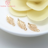 Vente en gros de pendentifs en laiton plaqué or champagne 24 carats de haute qualité, en forme d'ailes d'ange, tendance, pour la fabrication de bijoux DIY de haute qualité