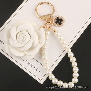 พวงกุญแจโลหะรูปไข่มุกใหม่ น่ารัก ประดับเพชร พวงกุญแจดอกไม้เล็กๆ ของตกแต่งกระเป๋าใส่หูฟัง - Product Image 6