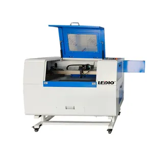 6090 Acrylic Cutting CO2 Laser Machine with up and down Table Bearing and PMI Guiderail Supports DST Graphics Format