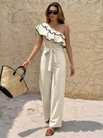 Combinaison asymétrique à volants et ceinture nouée, style vacances été 2026, avec empiècements color-block et bordure noire, personnalisable et en gros