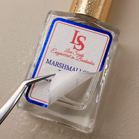Étiquette personnalisée imperméable pour flacon de parfum, autocollante en vinyle, résistante à l'huile, avec impression de logo et estampage à chaud bleu sur rouleau