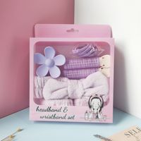 Lot de bandeaux moelleux avec nœuds, pinces à cheveux fleuries, bigoudis et élastiques pour coiffures quotidiennes et maquillage