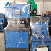 Machine de soufflage semi-automatique pour bouteilles PET de marque SMC, prix bas, état neuf, incluant PLC, pompe, moteur et roulement pour la fabrication de bouteilles PP
