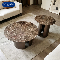 Table basse ronde moderne en marbre foncé avec base en acier inoxydable, durable et écologique, meubles de salon pour hôtel et appartement