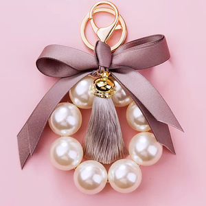 <span class=keywords><strong>Gros</strong></span> femmes grande perle noeud papillon sac <span class=keywords><strong>porte</strong></span>-clés cadeau tissu noeud noeud gland perle <span class=keywords><strong>porte</strong></span>-clés pour sac - Product Image 2
