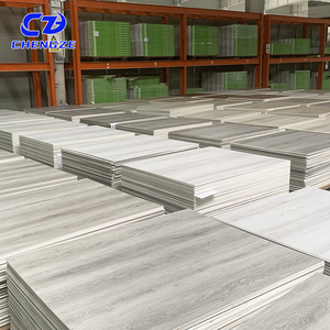 Plancher en vinyle SPC à prix d'usine, facile à installer, imperméable, ignifuge, écologique, design à grain plastique pour appartement - Product Image 2