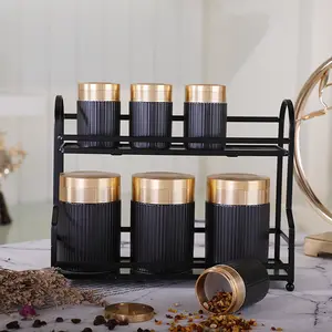 Commercio all'ingrosso elegante oro coperchio nero di zucchero da cucina barattolo di archiviazione di ceramica tè caffè canister set con supporto in metallo