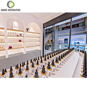Vitrine de présentation de parfums haut de gamme, présentoirs de rangement durables pour magasin de parfums avec forme incurvée, armoire de présentation de parfums pour magasin de parfums - Product Image 6