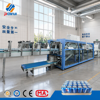 Machine d'emballage sous film rétractable automatique haute performance pour ligne de remplissage de bouteilles et de canettes