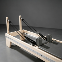 Machine de Pilates Reformer en bois massif à prix d'usine avec boîte de rangement et planche de saut pour studio