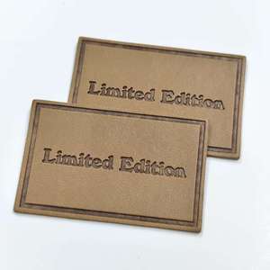 XP-Trending Etiqueta de cuero blanco personalizada con monograma Etiquetas de logotipo de cuero en relieve para bolsos de perfume Carteras y ropa de marca - Product Image 1