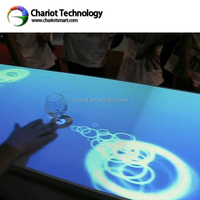 Table interactive personnalisée ChariotTech pour restaurant, table de jeux numériques avec copyright