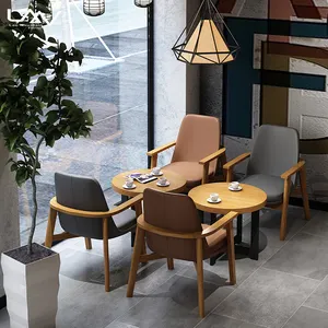 小酒馆咖啡厅酒店木制框架餐桌椅北欧风格客厅皮革口音餐厅扶手椅家具