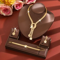 Parure de bijoux pour femme en alliage, super scintillante, avec pampilles et zircone cubique, comprenant collier, boucles d'oreilles et bracelet, élégante, pour mariée, mariage, fête ou cadeau de fête