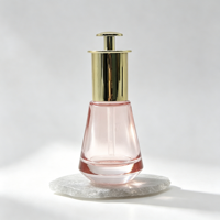 Flacon d'essence en verre rose trapézoïdal à fond épais de 30 ml, pompe compte-gouttes plaquée or, emballage de luxe pour sérum réparateur de soins de la peau