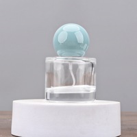 Flacons de parfum en verre transparent élégants de haute qualité, 30 ml, 50 ml, 100 ml, côtés lisses, forme cylindrique, pompe sérigraphiée