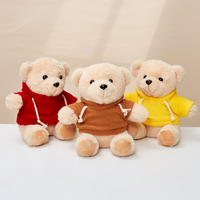 Ours en peluche avec logo personnalisé de l'usine de jouets en peluche professionnels 22cm Animal en peluche doux en chemise blanche et noire à capuche pour les anniversaires