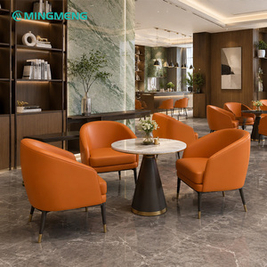 Ensemble de meubles de restaurant moderne, chaises en cuir PU orange, table ronde en marbre, structure en métal, sièges contemporains pour hôtel - Product Image 1