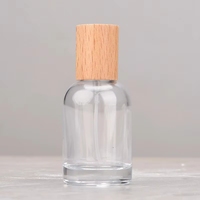 Flacon de parfum cylindrique de luxe à prix d'usine, base lourde, Dubaï, 30 ml, vide, avec pompe pulvérisatrice et sérigraphie sur bois