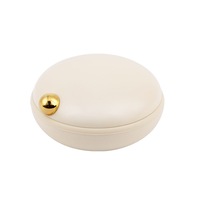 Boîte de rangement en plastique ronde miniature en gros avec 4 compartiments pour pilules à usage domestique
