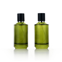 Flacon de parfum vide de luxe haut de gamme 100 ml transparent vert olive avec design d'épaule spécial et vaporisateur de brume parfumée