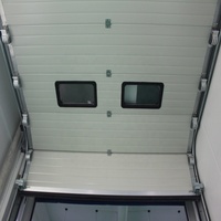 Portes sectionnelles industrielles avec capteurs de détection d'obstacles, activation automatique du recul pour usines et entrepôts.