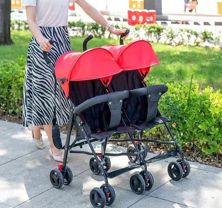 China Fabriek Hot Selling Lichtgewicht Nieuwe Stijl Draagbare Gemakkelijk Opvouwen Tweeling Kinderwagen Voor 0-36 Maanden Tweeling Meisjes Jongens