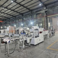 Machine d'emballage automatique sous film rétractable POF PE pour le traitement des rouleaux géants de serviettes de cuisine