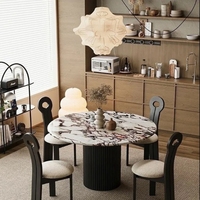 Table à manger en marbre de style crème moderne Plaque inférieure à support complet Conception ronde de haute qualité pour les petits ménages