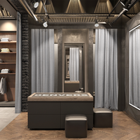 Présentoir de magasin de vêtements haut de gamme avec cabine d'essayage Étagères murales de vêtements en îlot en bois personnalisées vitrine en verre métallique